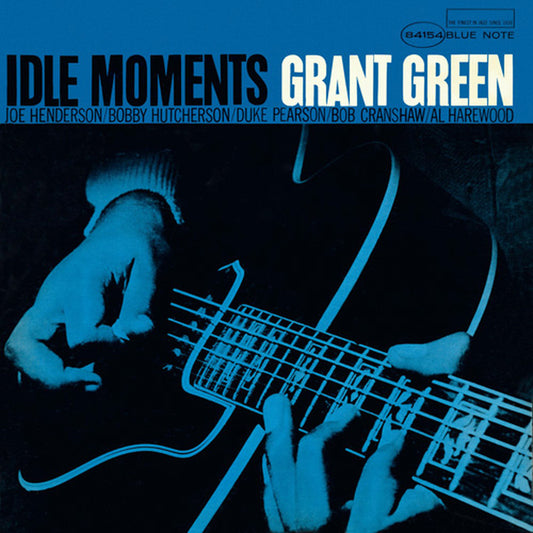 Album cover of 'Idle Moments' by Grant Green with hands playing guitar.