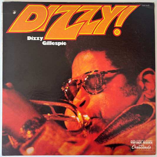 Album cover of Dizzy Gillespie's 'Dizzy!' featuring a close-up of the musician with sunglasses.