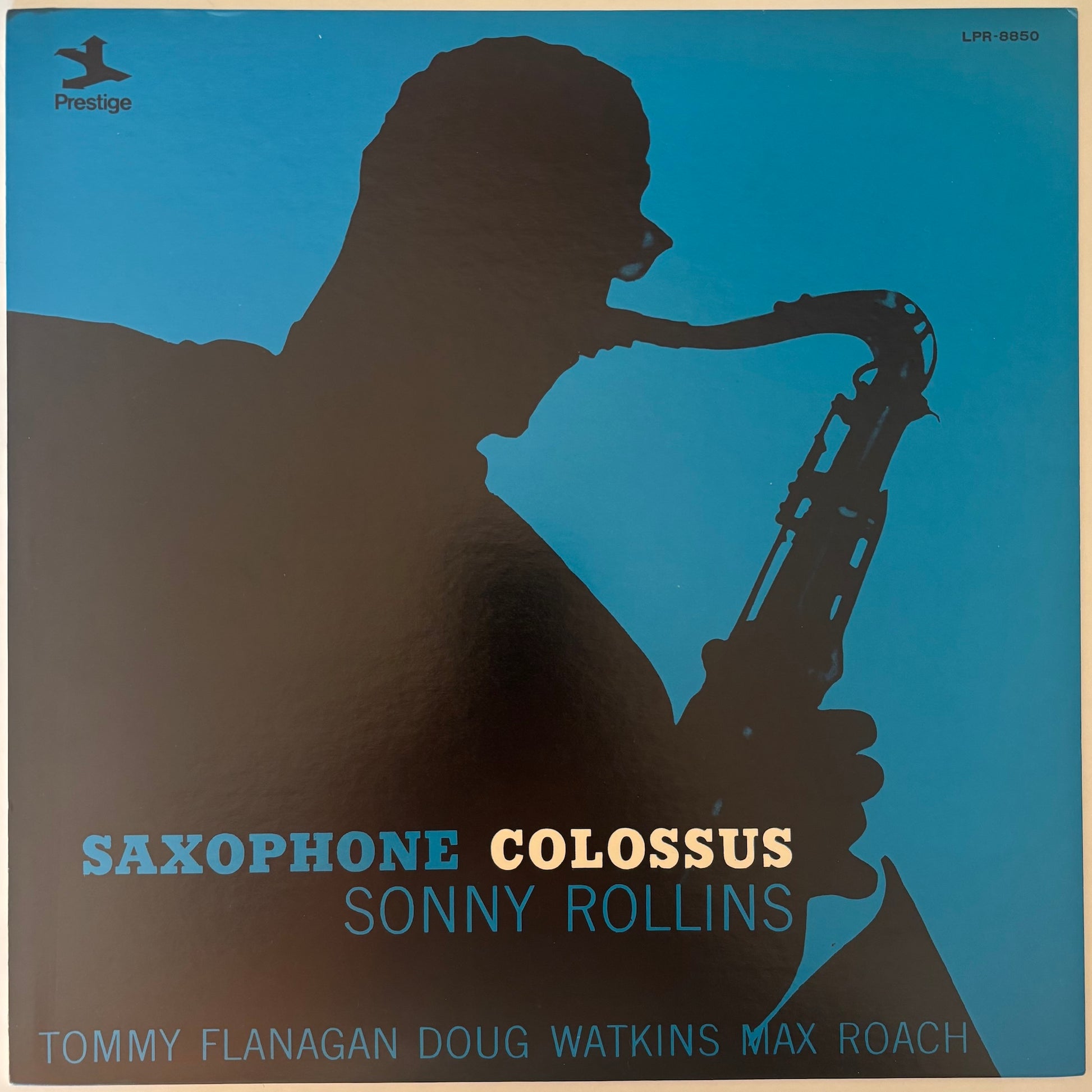 Album cover of 'Saxophone Colossus' by Sonny Rollins with a silhouette of a saxophonist on a blue background.