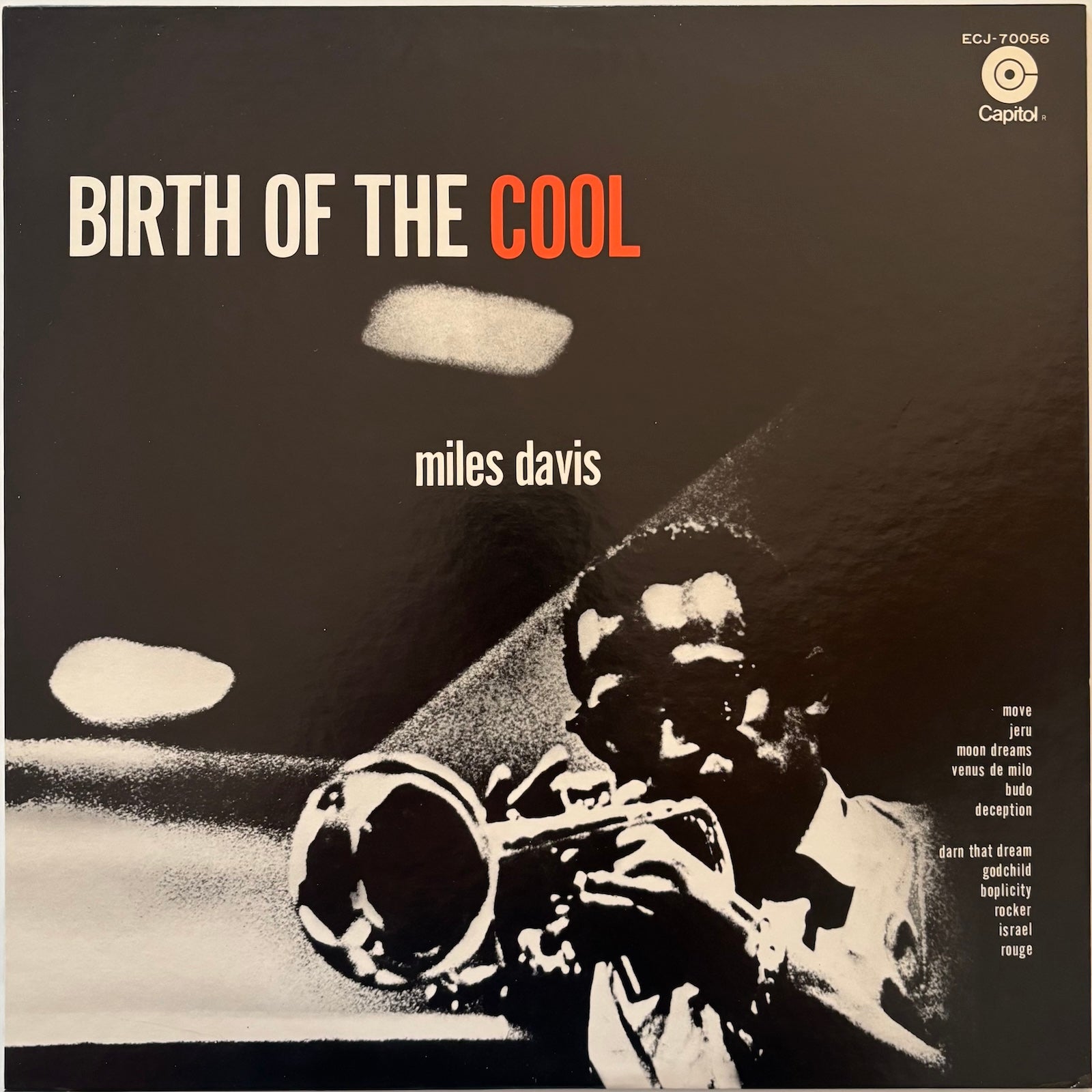 Album cover of 'Birth of the Cool' by Miles Davis with a black and white photo of a man playing a trumpet.
