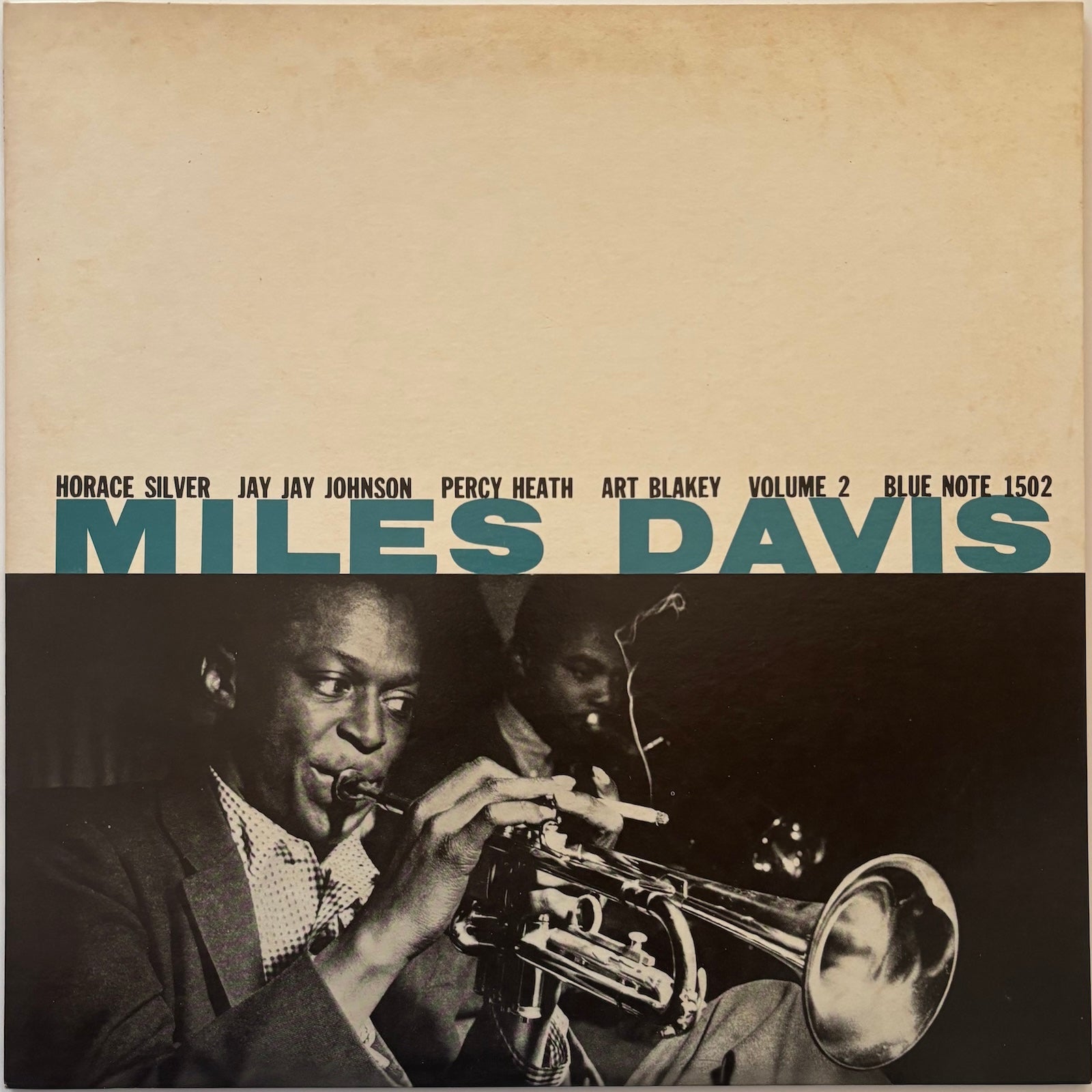 Album cover of Miles Davis Vol. 2 featuring Miles Davis playing trumpet with text about the album and musicians.