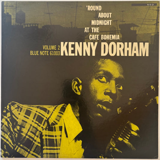 Album cover of 'Round About Midnight at the Cafe Bohemia' by Kenny Dorham with a portrait of the musician.