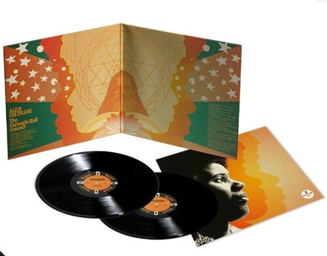 Vinyl records with a colorful album cover featuring a face and abstract design.